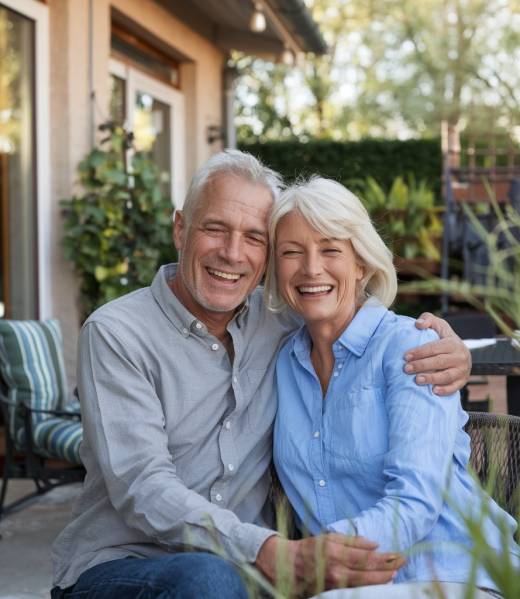 a-photo-of-a-happy-old-couple-sitting-in-front-of--Bc9X032uTTSsJgP-ZxRD2A-i3XWpXeESUSLpppOTAvUMA